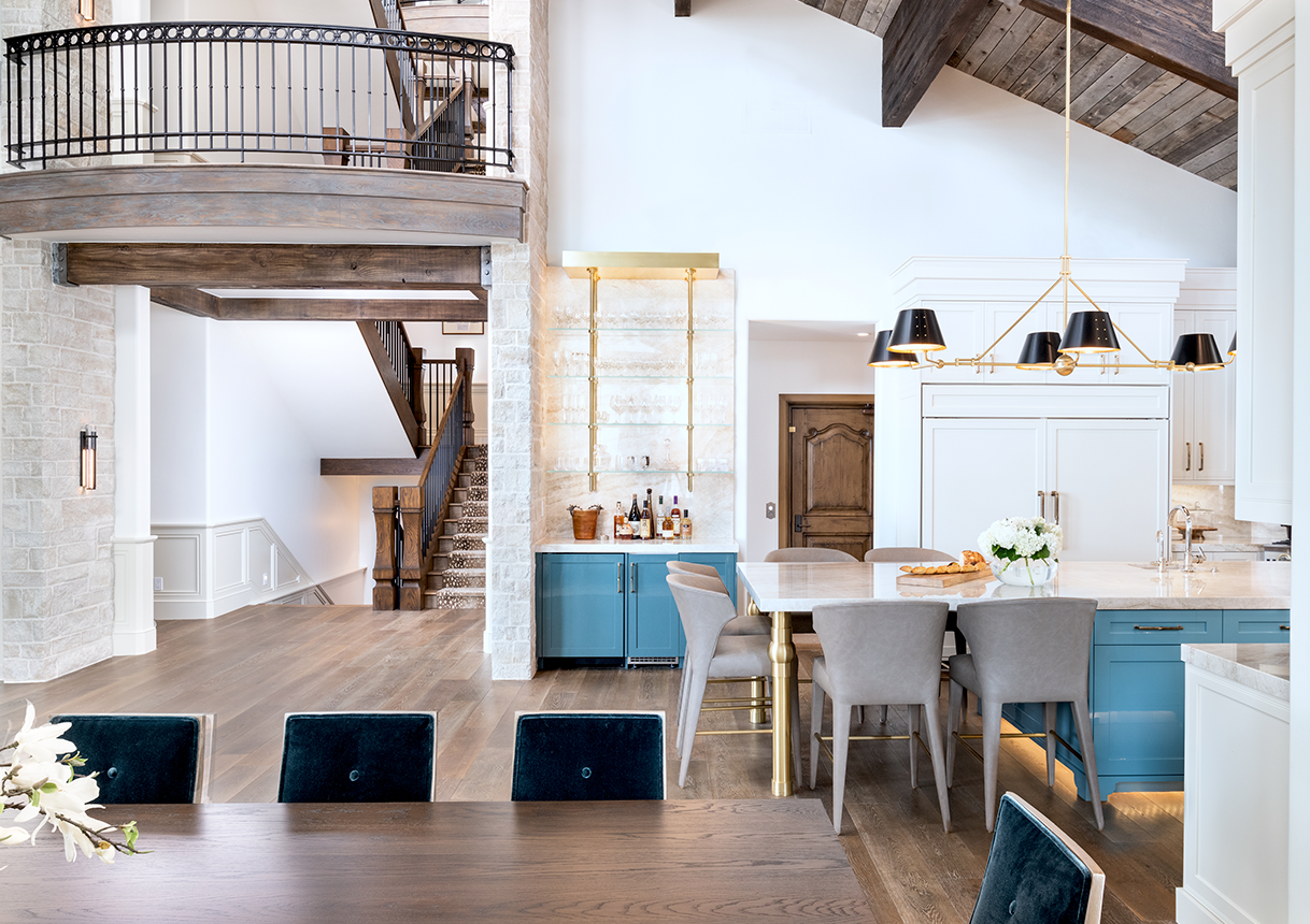 Brina wide plank European oak flooring through an open great room, staircase, and kitchen