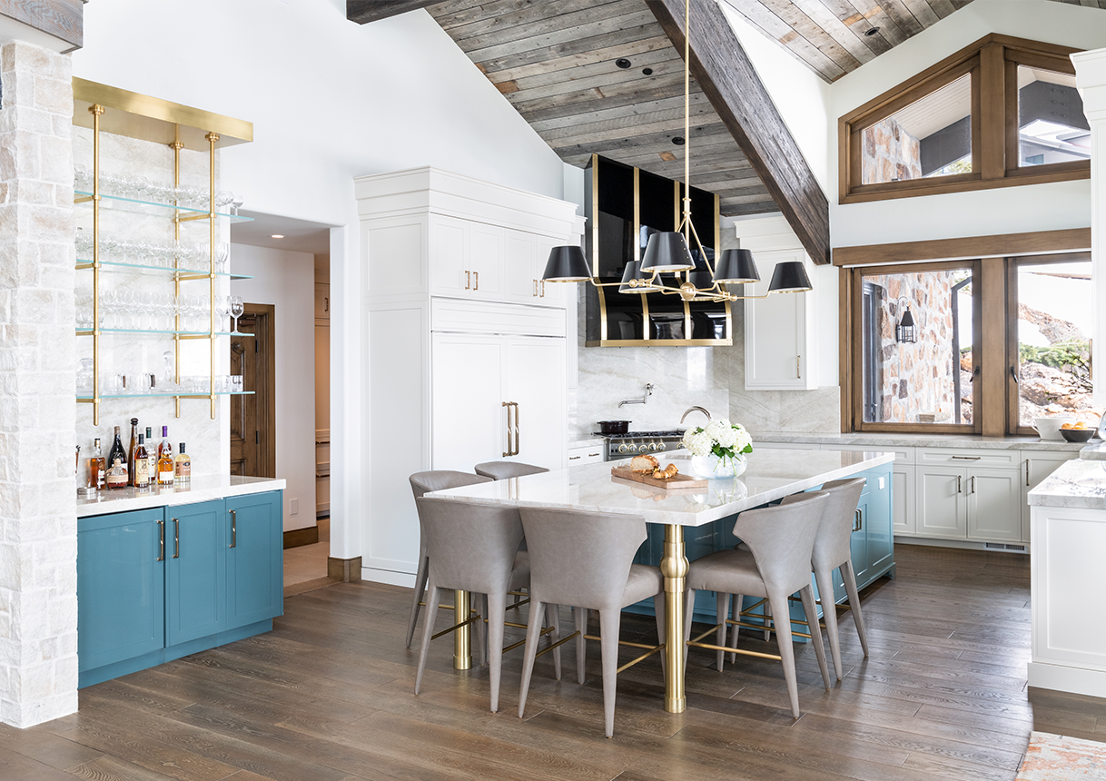 Brina wide plank European oak flooring in a kitchen with blue cabinetry and brass shelving