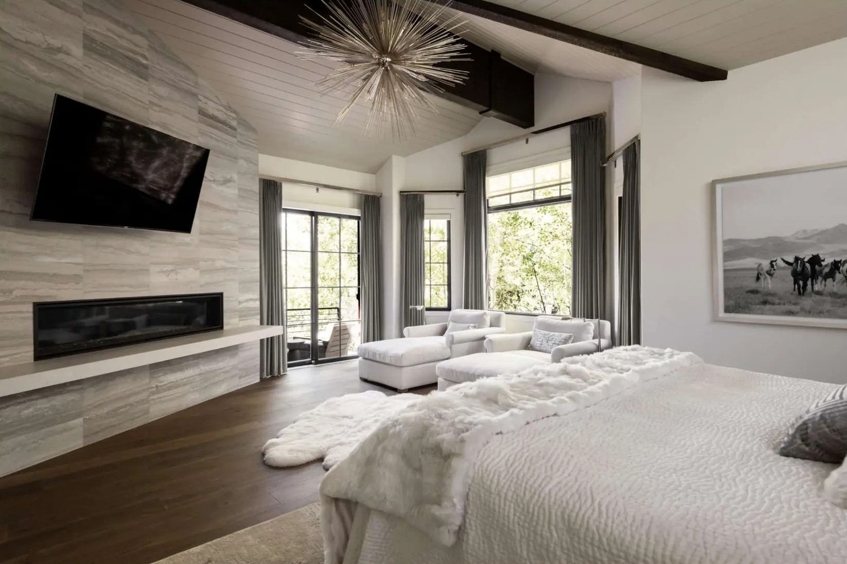 Amaro 8-inch wide plank American walnut flooring in a vaulted primary suite — Bella House project