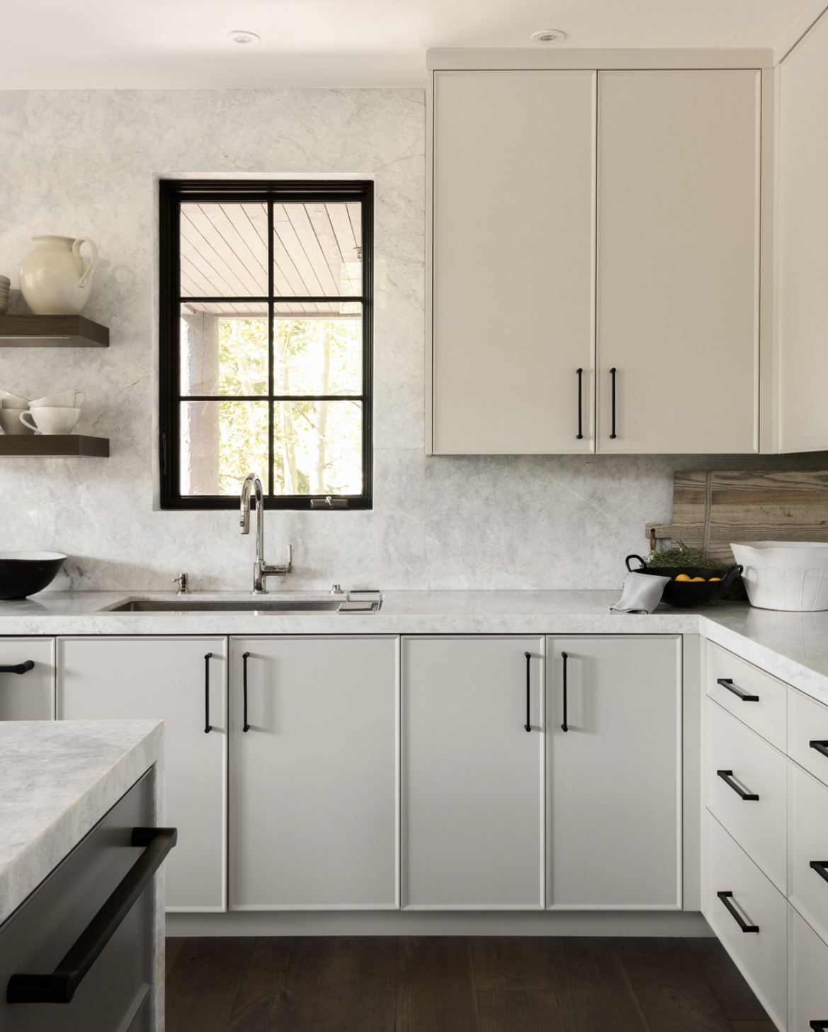 Amaro wide plank walnut flooring under marble counters in a bright kitchen — Bella House project